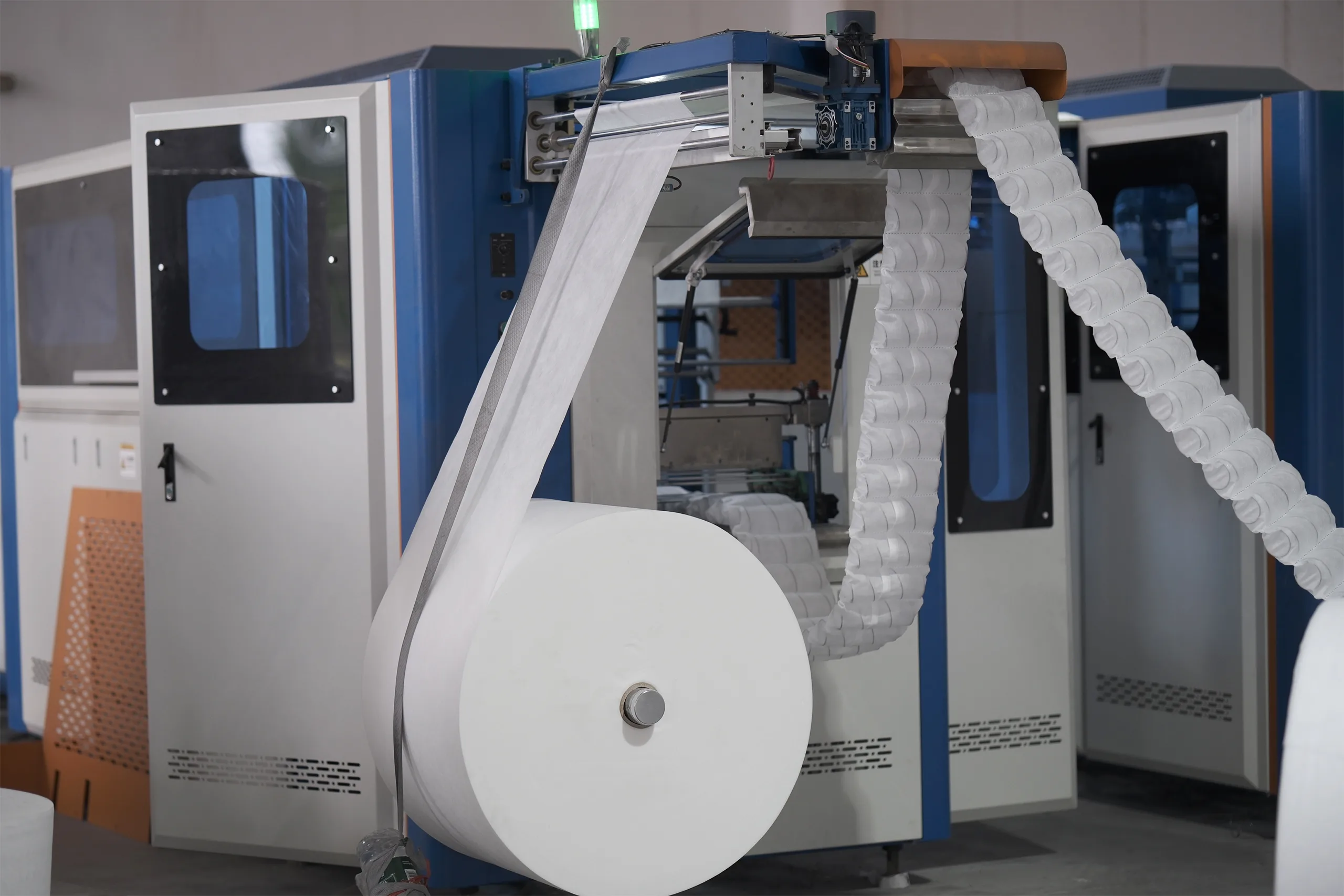 Automatic pocket spring coiling machine in operation for mattress production
