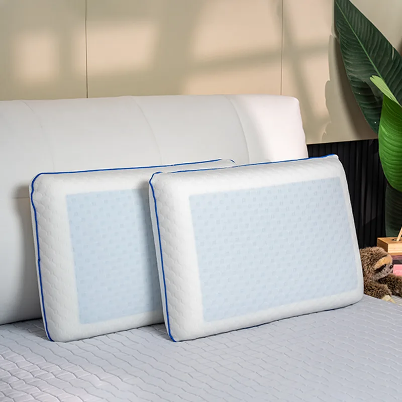 Two pillows standing upright against the bed headboard