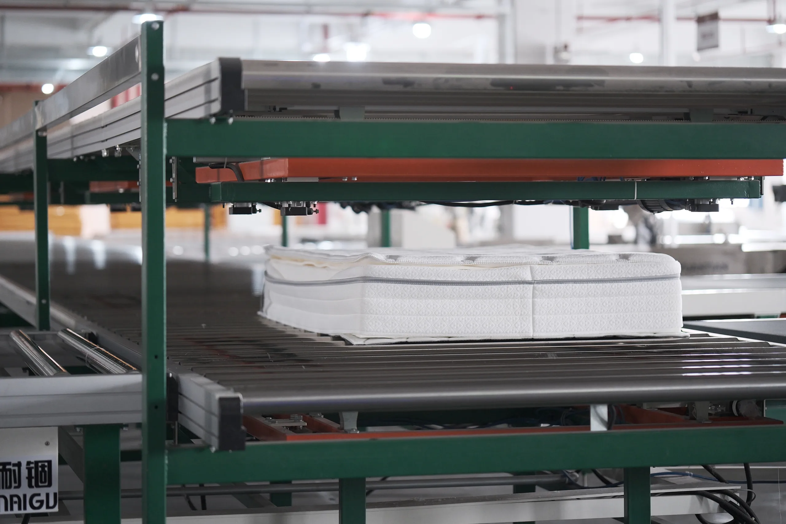 Mattress on automated conveyor line in factory production