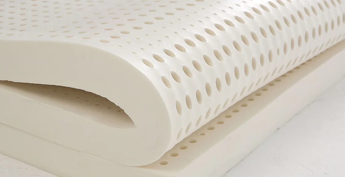 Folded latex mattress topper showing its flexibility and softness — part of the best latex mattress topper collection