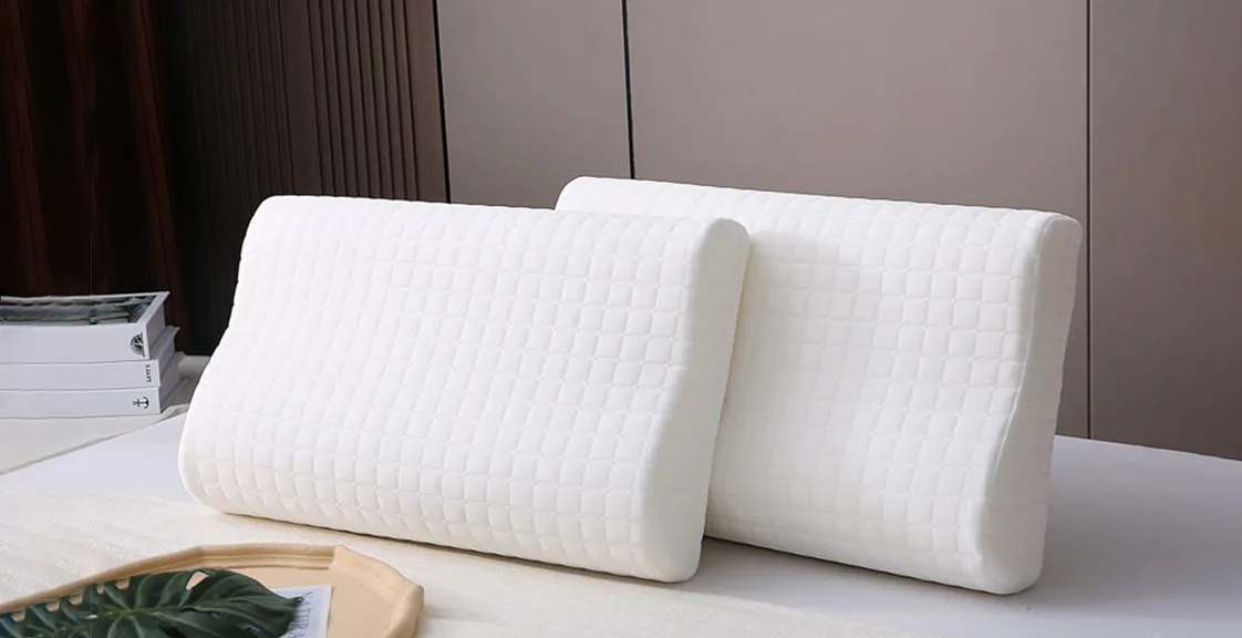 Two white memory foam pillows on a bed, illustrating how to wash a memory foam pillow