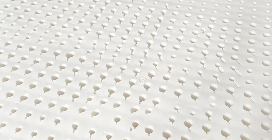 Close-up of natural latex material used in the Best Latex Mattress Topper, highlighting its soft, breathable, and supportive texture