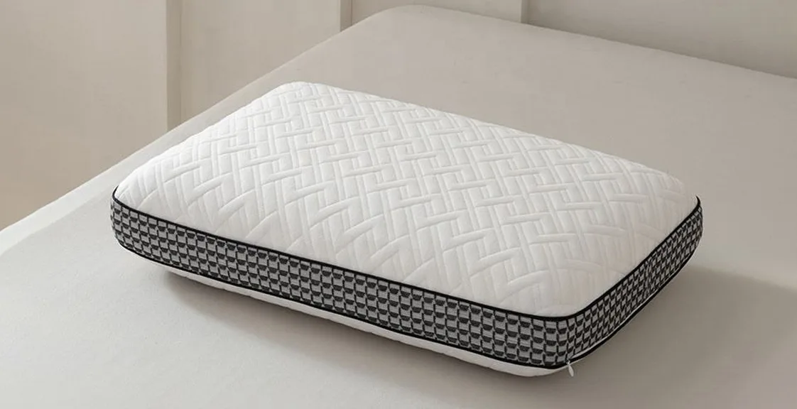 Memory Foam King Pillow in a bread shape with a black checkered pattern placed neatly on a bed