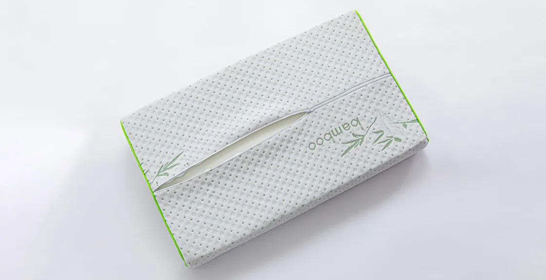 Back side of a memory foam pillow with the zipper open, showing the inner foam and removable cover — can you wash a memory foam pillow