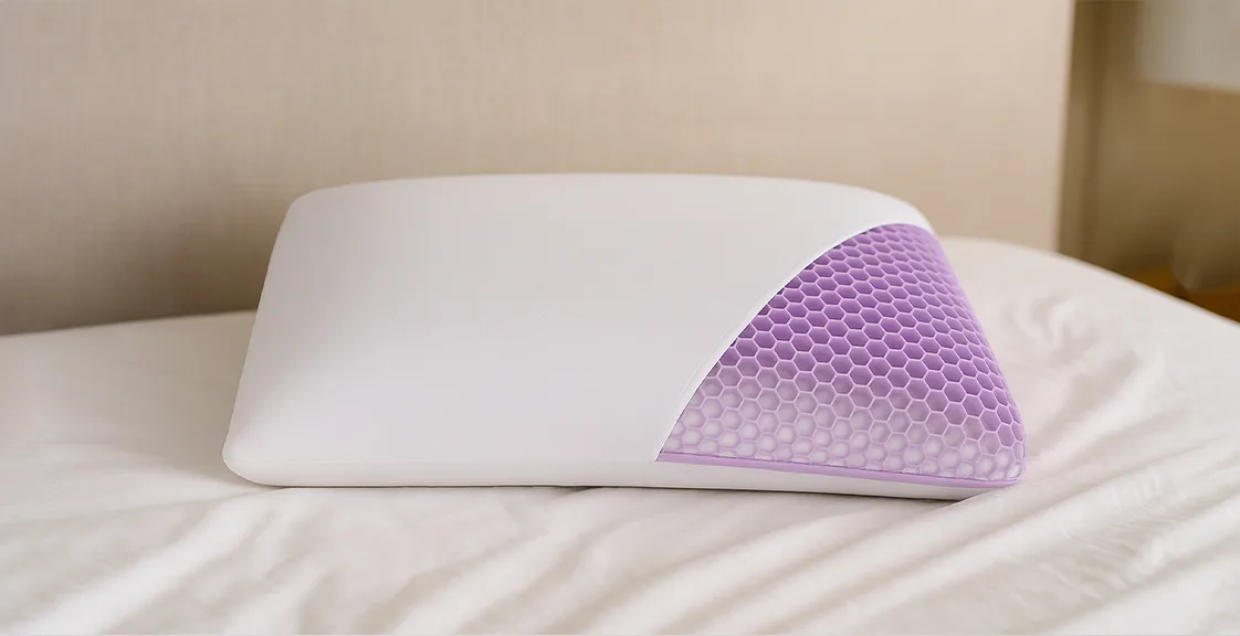 TPE pillow resting on a neatly made bed as the article cover for “What is a TPE pillow