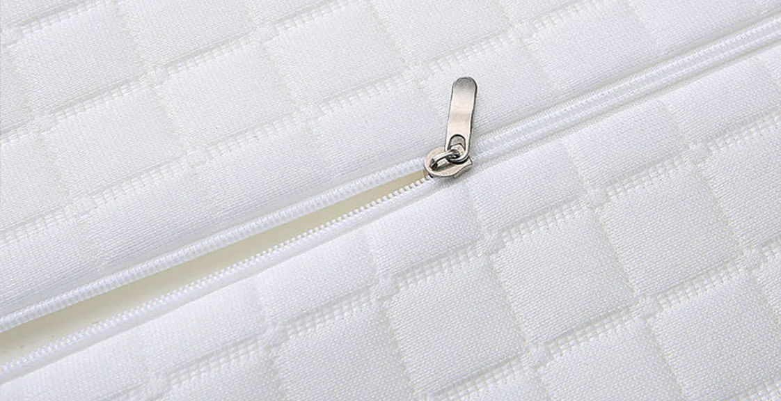 How to wash a memory foam pillow – close-up of the removable white pillow cover with zipper