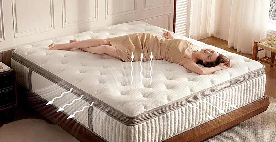 A woman lying on a white mattress, illustrating whether hybrid mattresses help with back pain.