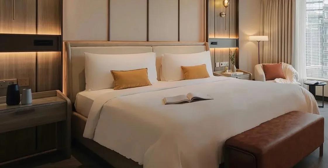 Modern hotel room with a project-grade pocket coil mattress built for durability and guest comfort
