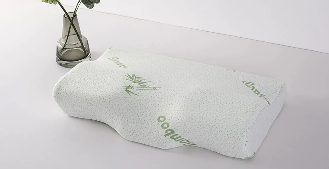 An ergonomic pillow with a bamboo cover