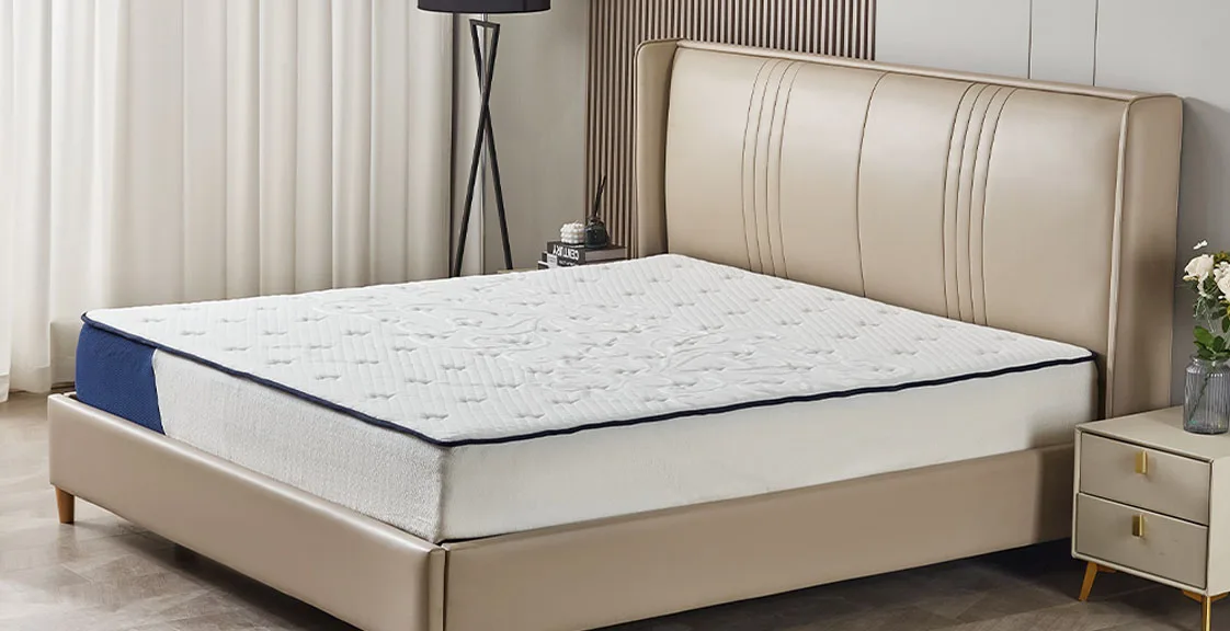 A white and blue memory foam mattress 