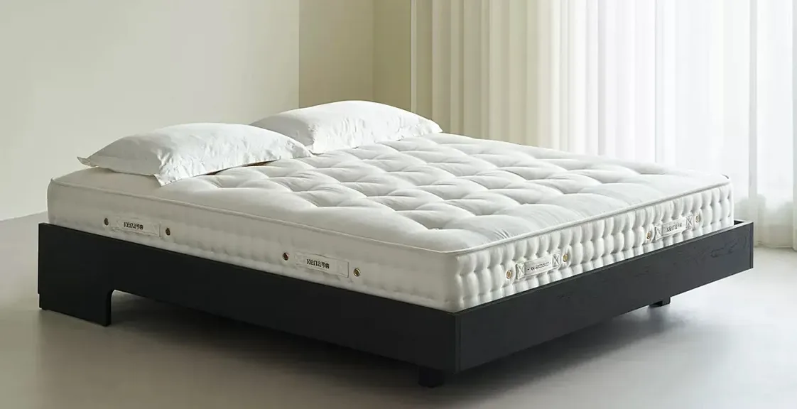 High-quality mattress on a modern bed frame