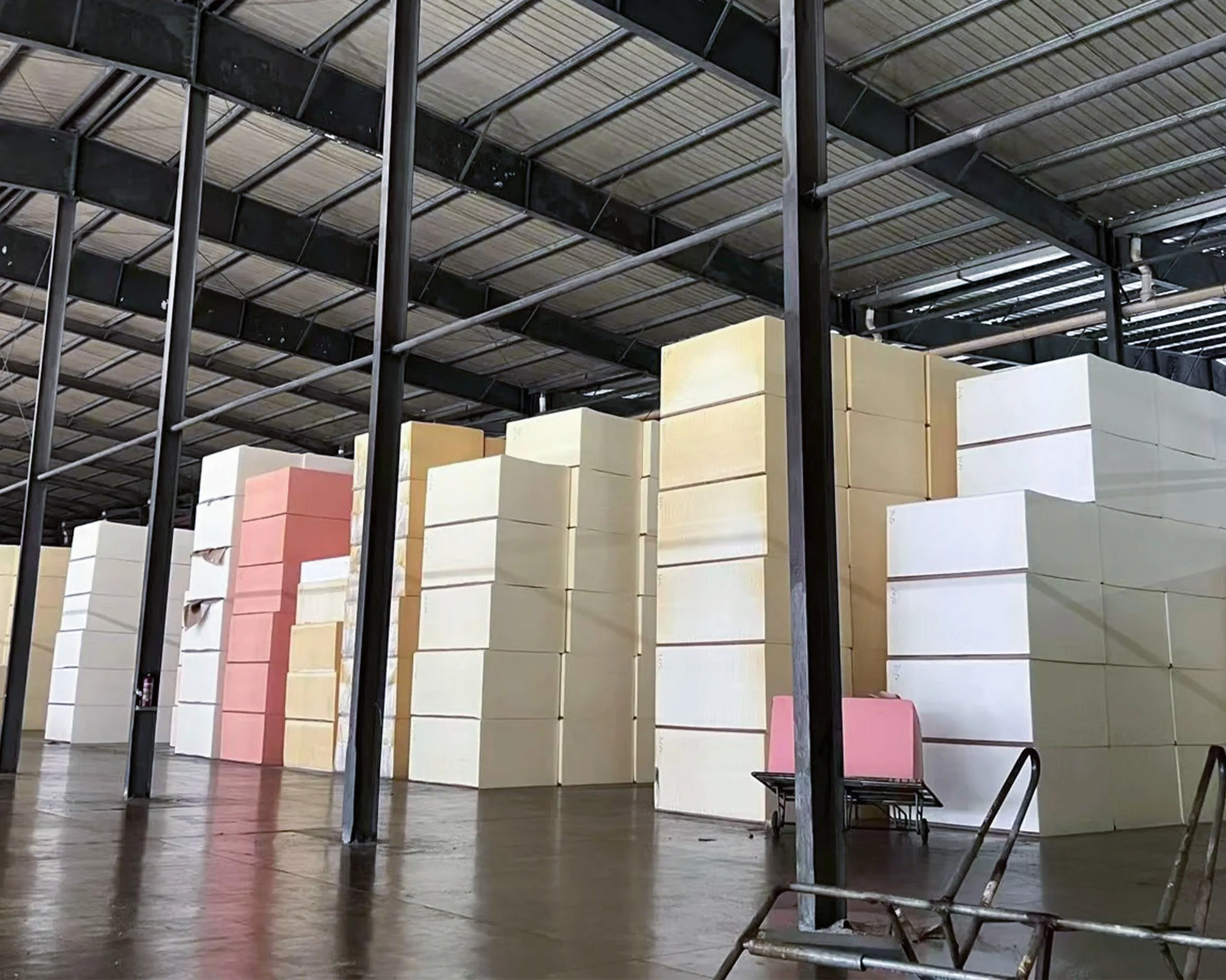 Foam materials neatly stored in factory warehouse with organized classification, ensuring stable supply and efficient production