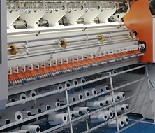 Automated mattress quilting machine